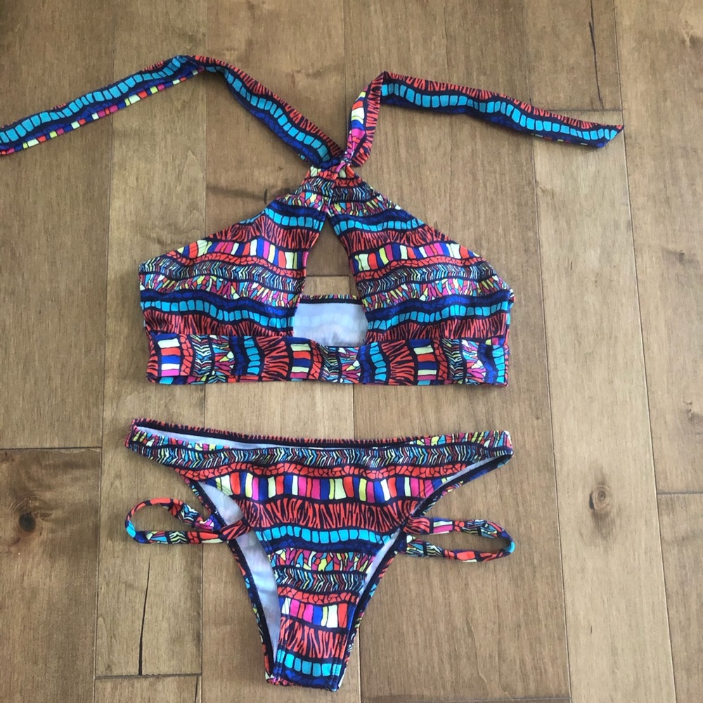 Brand new multi colored 2 pc swim suit.